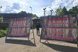Baliho Himbauan dan Larangan Pertambangan Ilegal di Ratatotok